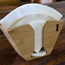 Stylish bamboo coffee filter holder for Aeropress, Chemex, and Hario Pour Over filters, offering a compact and eco-friendly storage solution. 