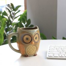 Cyan ceramic owl mug with a unique design, perfect for coffee, tea, and more, ideal as a gift or home décor. 