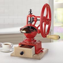 Classic Italian Espresso Grinder, featuring a beech wood base and red cast press design, perfect for creating fresh, aromatic coffee grounds. 