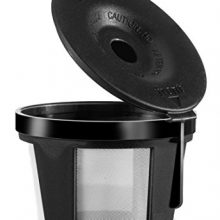 A sleek, reusable stainless steel coffee filter with a mesh design, set beside a Chefman Single Brew Coffee Maker and a cup of freshly brewed coffee. 