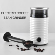 Compact electric coffee grinder with a sleek stainless steel finish, showcasing a secure glass lid and simple one-button operation for fresh coffee or spice grinding.