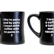 Two ceramic Death Wish Coffee mugs, each holding 14 ounces of coffee, with bold logos and motivational phrases, perfect for any coffee lover. 