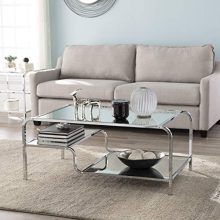 Southern Enterprises Coffee Table with asymmetrical chrome and mirrored finish, showcasing its modern design and two functional shelves. 