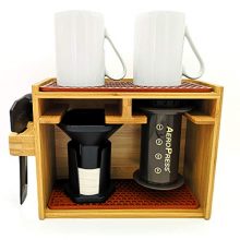 Bamboo AeroPress Organizer with compact design, holding AeroPress coffee maker, mugs, and accessories, featuring silicone drip mats for easy cleanup. 