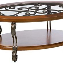 Traditional Glass Top Oval Coffee Table with Fixed Shelf and Intricate Carvings by Ashley Furniture