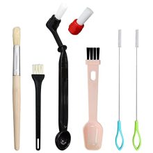 7-piece coffee cleaning brush set including wooden and plastic brushes, scoop brush, and steam wand brushes, designed for maintaining coffee grinders and machines. 