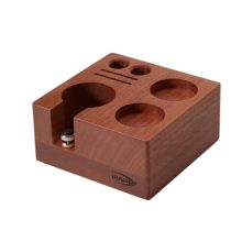 Elegant walnut wood espresso tamper holder with adjustable height and non-slip feet, designed to store up to 7 espresso accessories including portafilters and tampers.