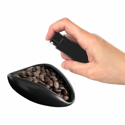 Coffee Bean Dosing Kit featuring a ceramic dosing tray and an 8ml aluminum-coated spray bottle for reducing coffee grind static. Essential coffee bar accessories in sleek black