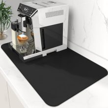 Super Absorbent Black Coffee Mat under a coffee machine, keeping the counter clean and dry 