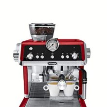 De'Longhi EC9335R La Specialista Espresso Machine with sensor grinder, dual heating system, and advanced latte system in stainless steel with red accents. Features include a hot water spout and a compact design, ideal for home kitchens.