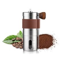 Shiawase Manual Coffee Grinder in brown stainless steel with a hand crank and ceramic burr. Features adjustable grind settings and a compact, portable design ideal for home use, office, camping, and travel.