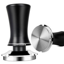 53mm Spring-Loaded Coffee Tamper with ergonomic walnut handle and stainless steel base, featuring built-in sound feedback for consistent pressure