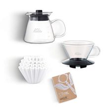 Kalita Wave Pour-Over Coffee Kit showcasing the glass dripper, filters, and glass server with etched measurements, perfect for precise coffee brewing