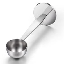 Stainless steel dual-purpose coffee scoop and tamper tool for measuring and tamping coffee grounds. 