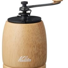 Kalita KH-9N Hand Coffee Grinder in natural rubber wood and cast iron, showcasing its elegant design and compact size for manual coffee grinding