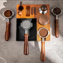 9-in-1 Espresso Tamping Station and Knock Box with removable waste bin, non-slip feet, and compatibility with multiple portafilter sizes for efficient coffee tool organization.