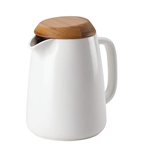 A sleek 34-ounce BonJour Wayfarer Ceramic Coffee Pot in matte white with a stylish teak wood lid, showcasing its modern design and wide handle for easy pouring.