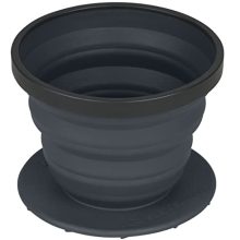 Sea to Summit X-Brew Collapsible Coffee Dripper in charcoal color, shown folded flat alongside reusable stainless-steel mesh filter, ideal for camping and travel.