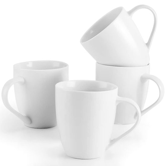 Set of 4 large white ceramic coffee mugs with sturdy handles, perfect for coffee, tea, and hot cocoa, displayed on a clean kitchen table