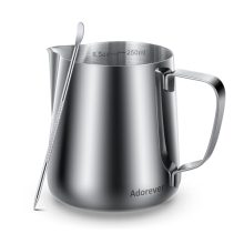 Stainless steel 8.5oz milk frothing pitcher with latte art pen, perfect for making professional-quality coffee drinks at home.