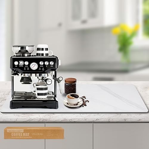 A sleek marble coffee mat placed under a coffee machine on a countertop, showcasing its large size and absorbent properties, with a clean and organized kitchen setup in the background.