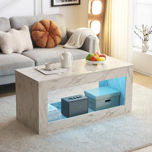 White faux marble coffee table with LED lighting and open storage cube, designed as a modern centerpiece for the living room.