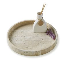 Elegant travertine marble vanity tray on a wooden dresser, holding jewelry and perfumes, showcasing its natural beige color and rustic charm.