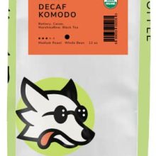 Blind Dog Coffee decaf whole beans in a 12 oz bag, medium roast with Swiss Water Process for low acidity, featuring rich cocoa and marshmallow notes ideal for cold brew. 