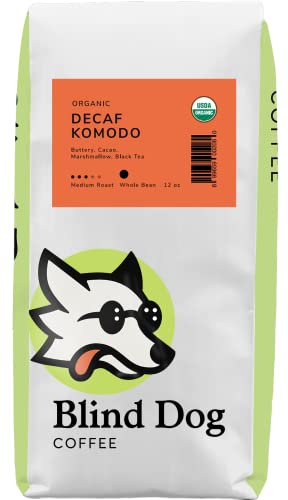 Blind Dog Coffee decaf whole beans in a 12 oz bag, medium roast with Swiss Water Process for low acidity, featuring rich cocoa and marshmallow notes ideal for cold brew. 