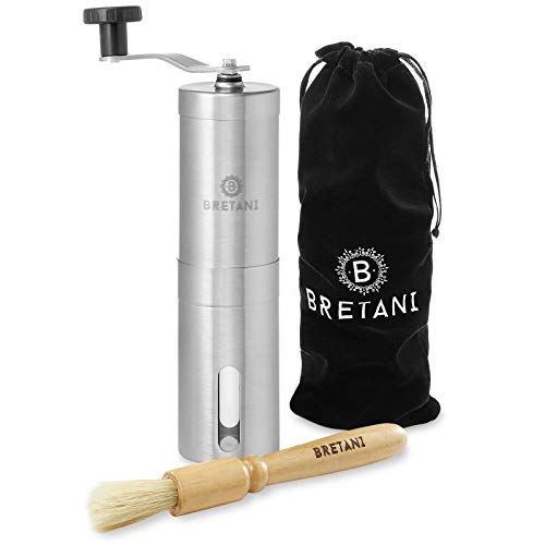 Bretani Manual Coffee Grinder in brushed stainless steel with an adjustable conical burr mill. Includes a grinder cleaning brush and travel bag