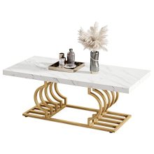 Modern 47-inch white faux marble coffee table with a gold metal frame and geometric design, placed in a stylish living room setting. 