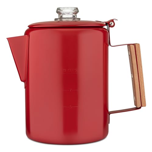 Red Bozeman Camping Coffee Pot with a hardwood handle, stainless steel body, and glass top, brewing coffee over a campfire.