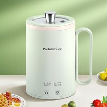 Compact green portable electric kettle with temperature control and timer, ideal for travel and small spaces, 400ml capacity.