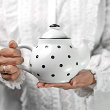 26 oz ceramic teapot with black and white polka dots, featuring a comfortable handle and drip-free spout, perfect for serving tea and coffee.
