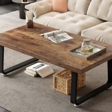 Rustic brown wooden coffee table with industrial black metal legs, featuring open storage space beneath the tabletop, perfect for living rooms and home offices