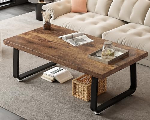 Rustic brown wooden coffee table with industrial black metal legs, featuring open storage space beneath the tabletop, perfect for living rooms and home offices