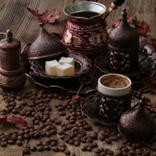 14-piece Turkish coffee set including handmade copper coffee pot, two coffee cups, tray, grinder, coffee beans, and accessories. Ideal for traditional coffee brewing for two.