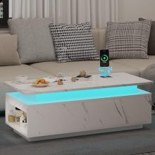 Modern LED coffee table with high-gloss white finish, integrated Bluetooth speaker, wireless charging, and touch control LED lighting system. Features a 2-tier open storage cabinet and sturdy construction. Ideal for living rooms, bedrooms, and offices.