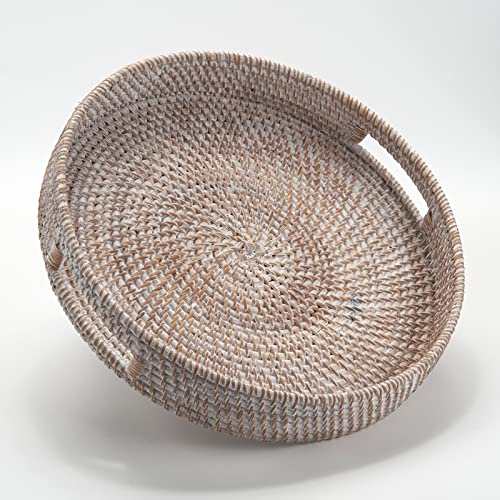 Large round rattan tray with handles, perfect for home decor and serving, featured in rustic white on a modern coffee table