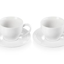 Le Creuset set of 2 white cappuccino cups and saucers made of durable stoneware, featuring a scratch-resistant enamel and 7oz capacity. 