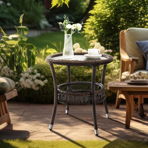 Round outdoor wicker coffee table with a black glass top and lower storage basket, designed for patios, balconies, and decks, featuring durable construction and elegant appearance