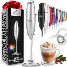 A sleek silver Zulay Handheld Milk Frother with a stainless steel whisk, effortlessly creating creamy foam in a glass of milk, set against a modern kitchen backdrop