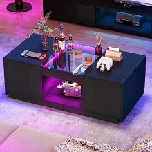 Modern black coffee table with LED lights, glass top, and built-in USB and Type-C charging ports, featuring two storage drawers and a sleek design for contemporary living rooms.