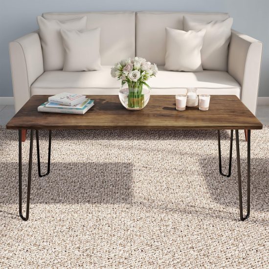 Modern coffee table with a distressed woodgrain top and sleek hairpin legs, perfect for adding a stylish touch to any room, featuring a compact design ideal for small spaces.