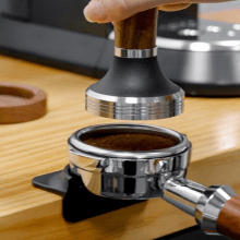Silicone Espresso Tampers Mat in black, green, and grey, designed for stable tamping of 51/54/58mm portafilters, offering scratch-proof and anti-skid features.