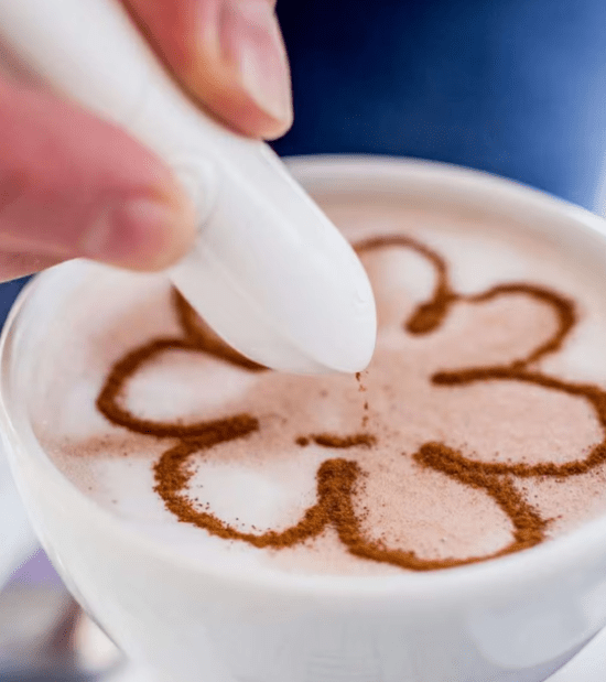 Electric latte art pen in white for easy coffee and cake decoration, with button-operated design.