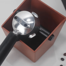 Compact anti-slip coffee knock box for easy disposal of coffee grounds, with durable ABS construction and sleek design. 