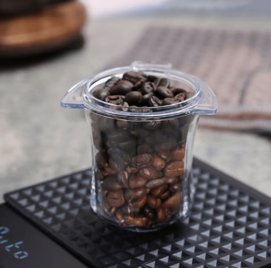 A stainless steel 54mm dosing cup designed to fit Breville espresso machines, allowing for precise, hands-free coffee grinding