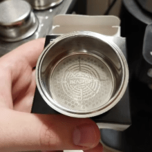 IKAPE Precision High Extraction Coffee Filter in stainless steel, designed for bottomless portafilters, enhancing flavor and coffee extraction.
